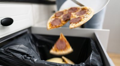 Food Waste. Throw Away Pizza In Dustbin